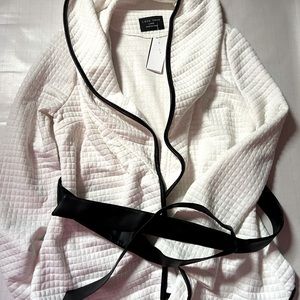 White quilted jacket with black trim & belt. Brand new!